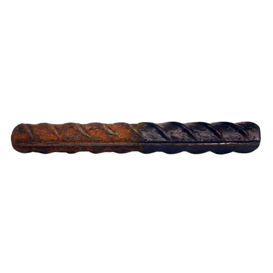 A metal bar with its left side rusted and its right side treated with CorrVerter.
