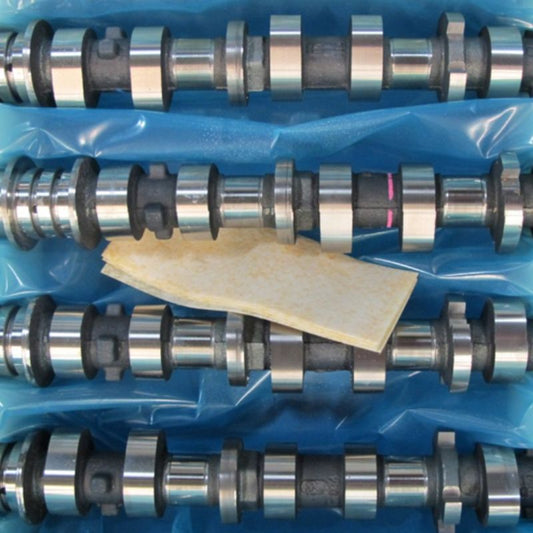 A Cortec Biopad placed between metal parts to be packaged.