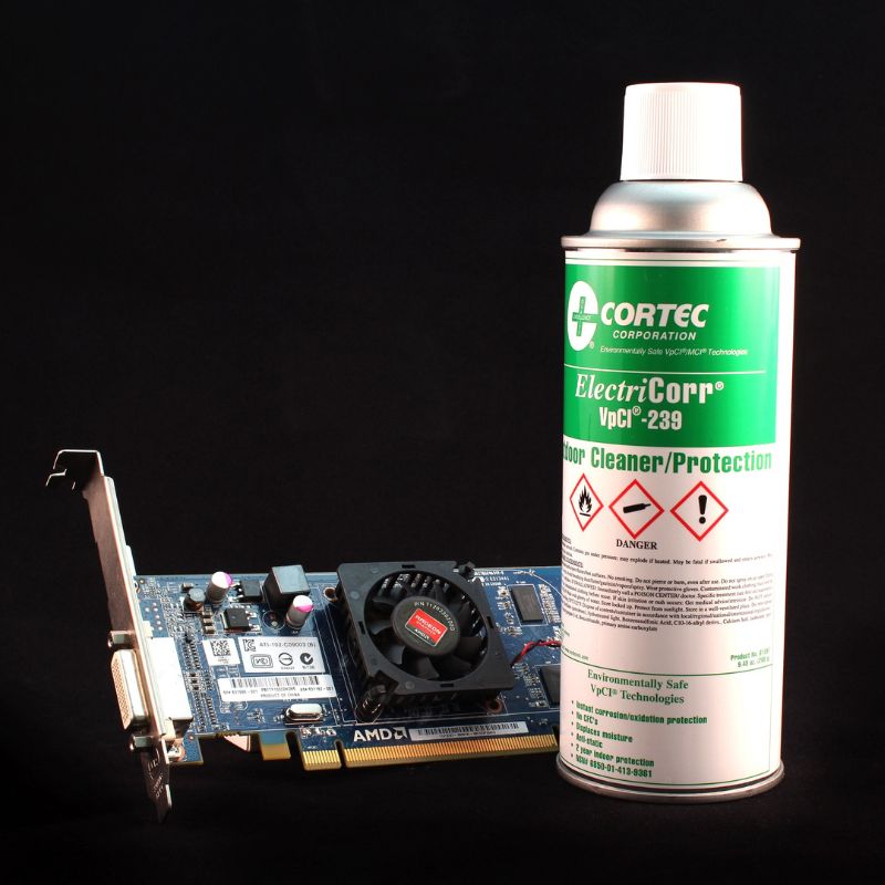 Can of Cortec ElectriCorr VpCI-239 Anti Rust Spray next to electronic component.