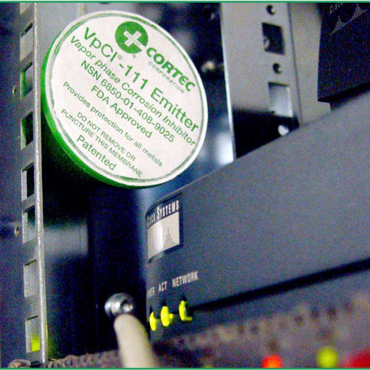 Cortec VpCI-111 VCI anti rust emitter cup placed on server data center for corrosion prevention.
