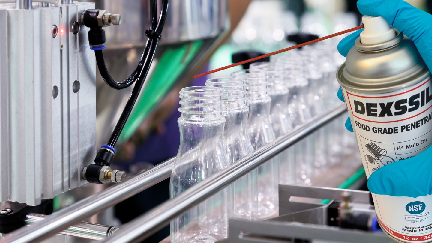 A beverage processing line being lubricated with Dexssil Food Grade.