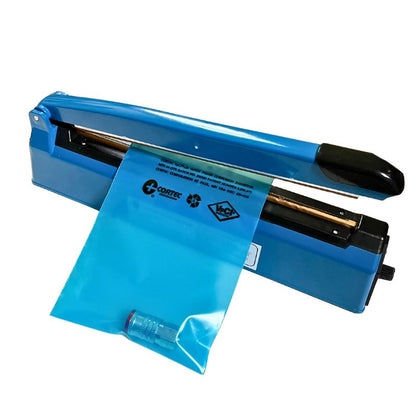 A Cortec VpCI-126 Heat Sealable bag containing a metal part, being sealed on an impulse sealer.