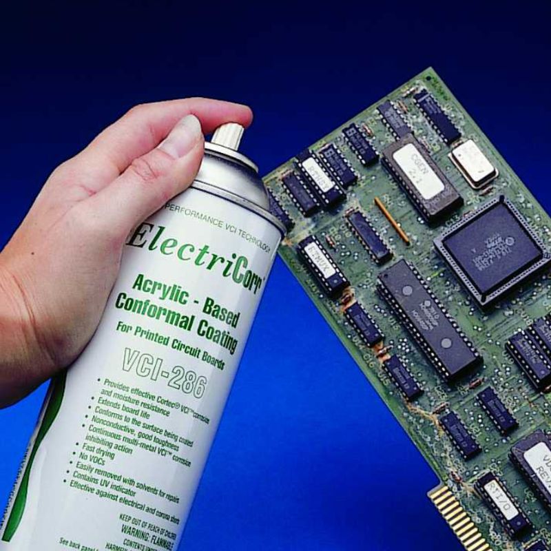 A circuit board next to a can of ElectriCorr VpCI 286