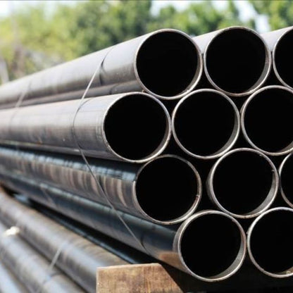 Pile of metal pipes protected with Cortec VpCI-391 Rust Preventive non tacky coating.