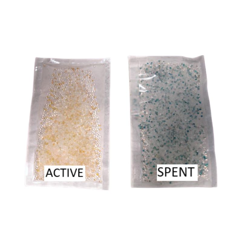 Two Desicorr pouches, one showing active spheres, and the other showing spent spheres.