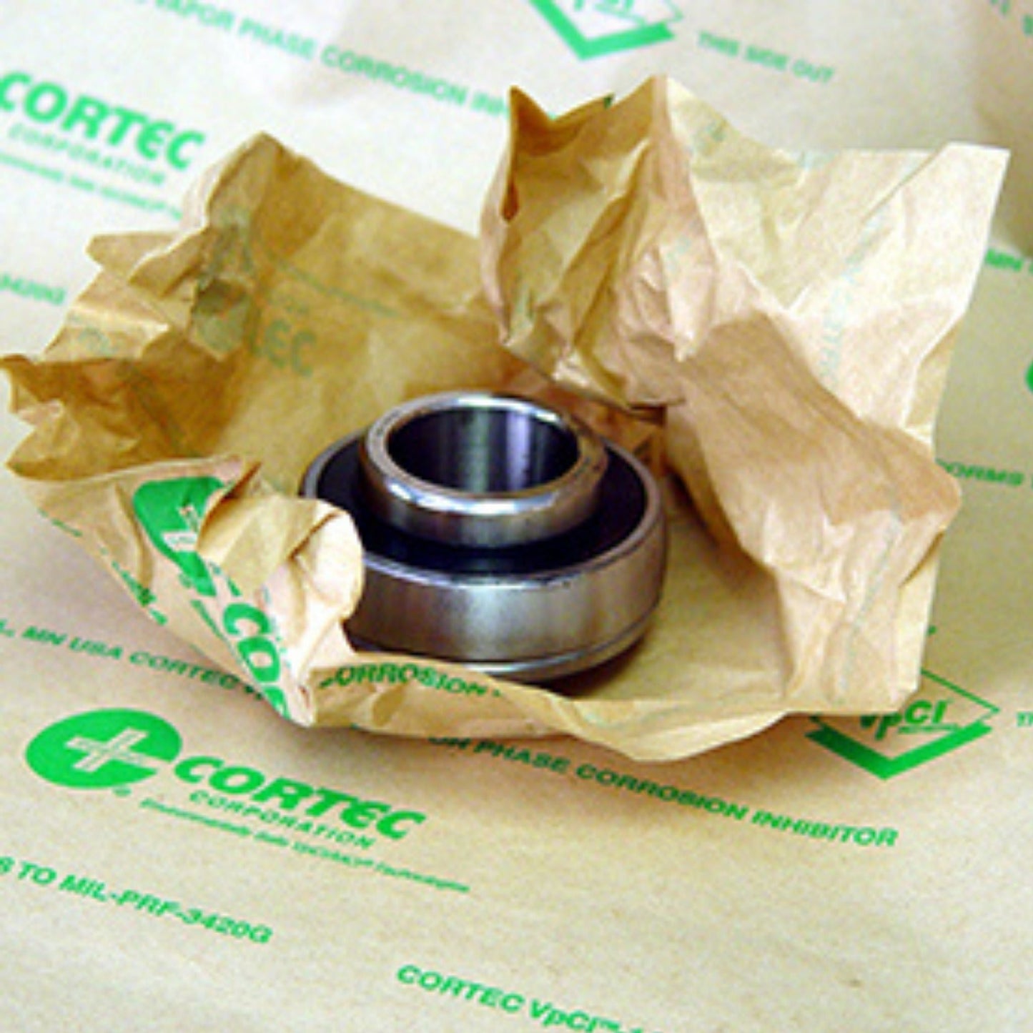 A bearing wrapped with Cortec VpCI-146 rust inhibitor paper.