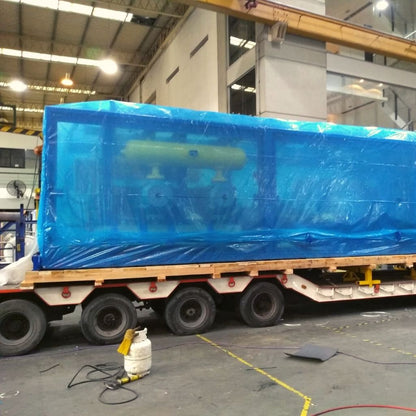 A big industrial machine protected with Cortec Anti Rust Shrink Film that has been heat sealed with a heat gun.