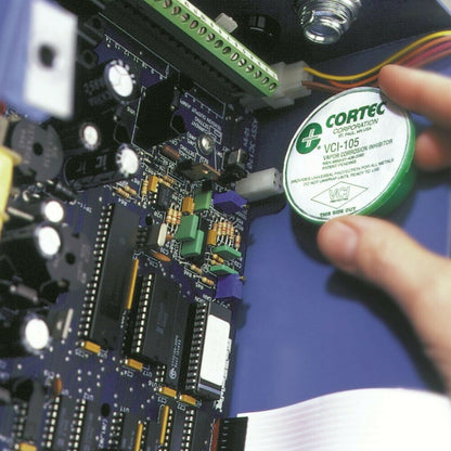 Cortec VpCI-105 VCI anti rust emitter cup inside an electronic cabinet.